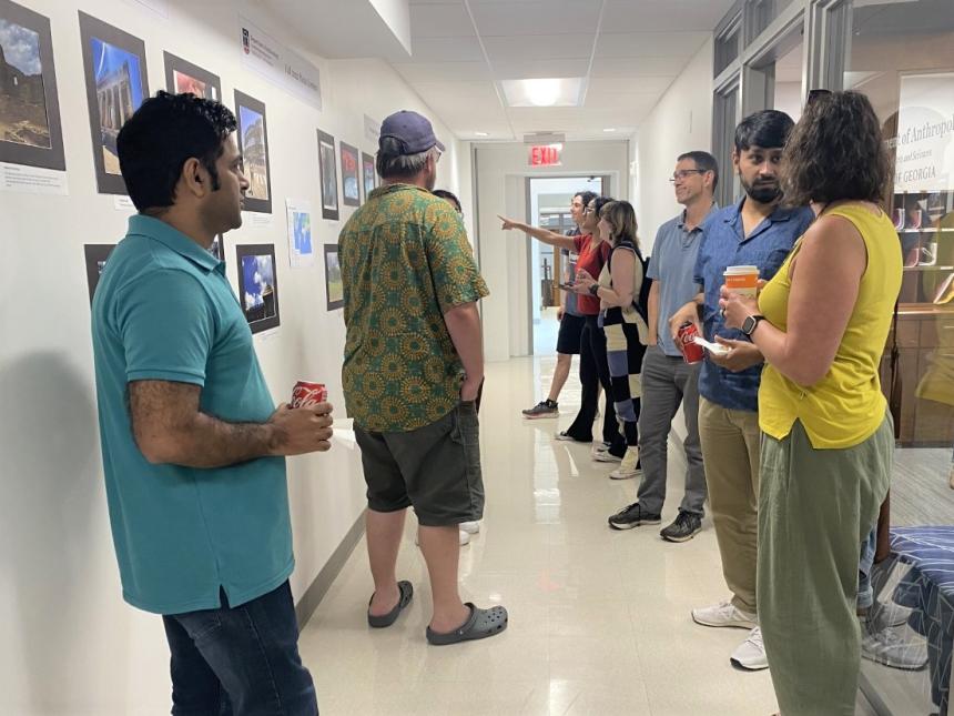 students and faculty gathered at gallery show