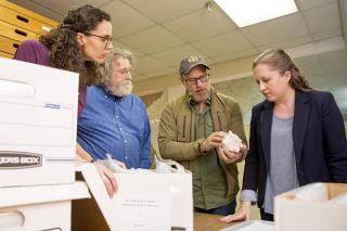 members of the UGA archaeology department and the lab director of the Nels Nelson North American Archaeology Laboratory at the American Museum of Natural History examine artifacts from the collection