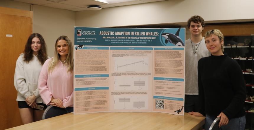 students with their poster on orcas