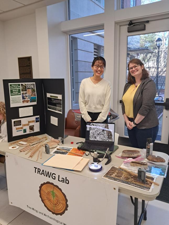 Anthropology PhD student Seungyeon Hong and Dr. Brita Lorentzen invited participants to examine tree rings under microscopes, demonstrating how dendrochronologists use them to study past climates, natural disasters, and historical events.