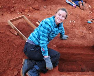 Laurie Reitsema working at an archaeological dig site