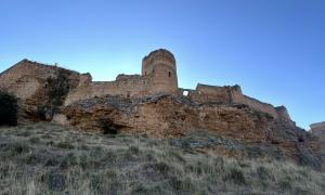 An early morning view as our excavation team walks up to the castle to begin removing skeletons from the ground. 
