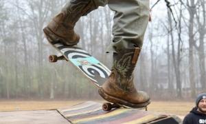 Carter Bass, the founder of BassLand DIY, catches some air on the ramp in his cowboy boots. 