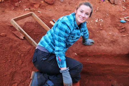 Laurie Reitsema working at an archaeological dig site